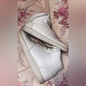 White Nike high tops. They are a little scuffed but are in good shape.